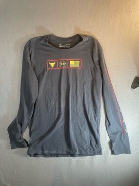 Under Armour Black Long Sleeve Tee with Yellow & Red Chest Icons